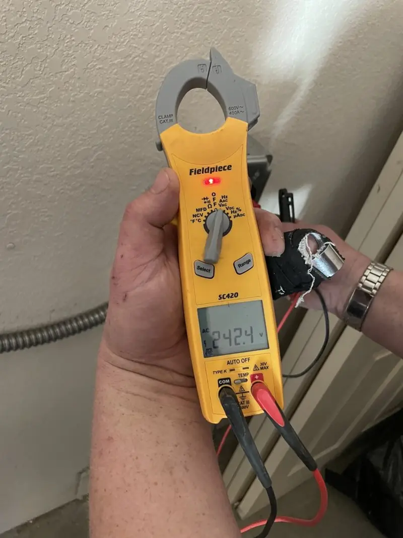 Voltage testing with clamp meter during Electrical Installation Services in West DeLand